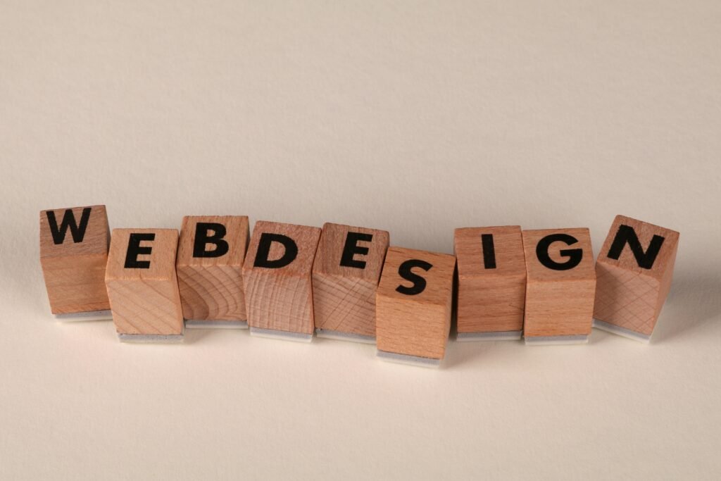 pexels-photo-32342294-32342294 Wooden blocks spelling 'web design' creatively showcase digital design concept.